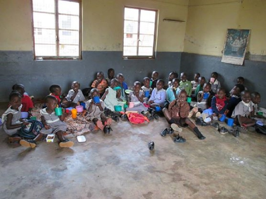 The children in the Baby Class and Top Class at St. Anthony's Nursery School take a break for porridge.
