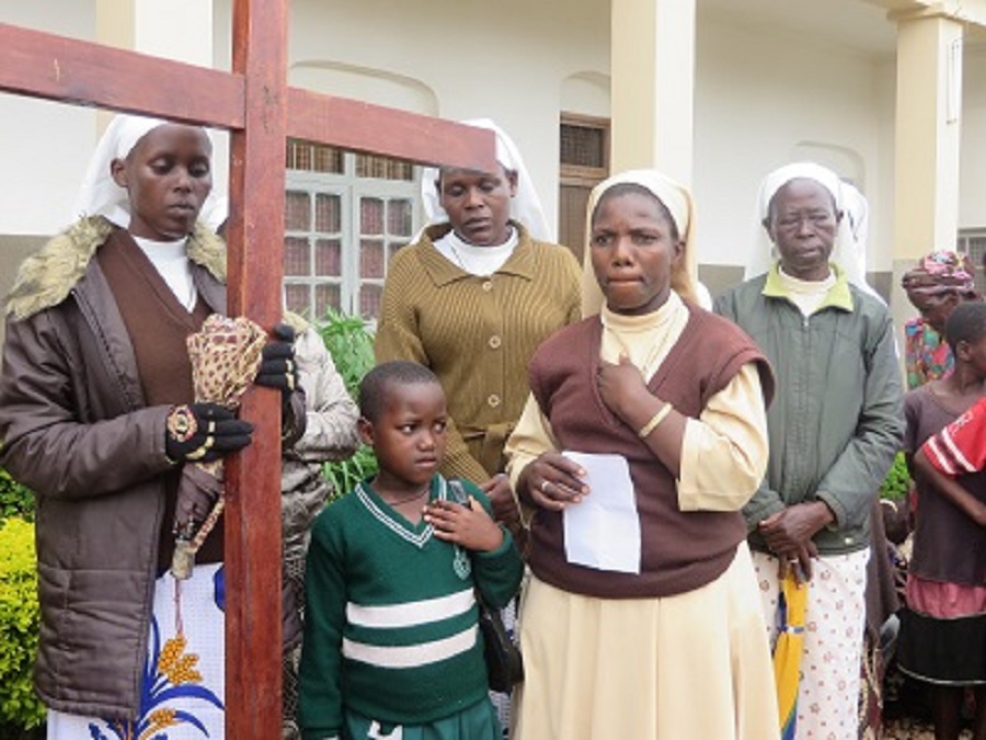 The head teacher from one of the school's in CARITAS For Children's child sponsorship program at the Fourteenth Station. She prayed for peace in the whole world.