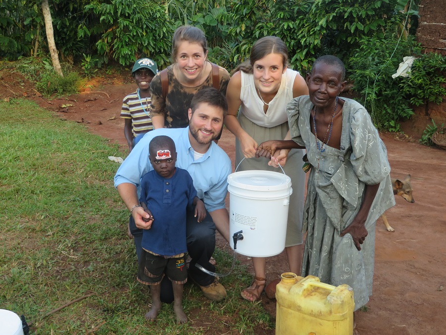 We pause for a photo with the new filter. Ben, the child Kollin sponsors, is standing in front of Kollin. Catherine is behind him. I am in the middle and Angela is to the right.