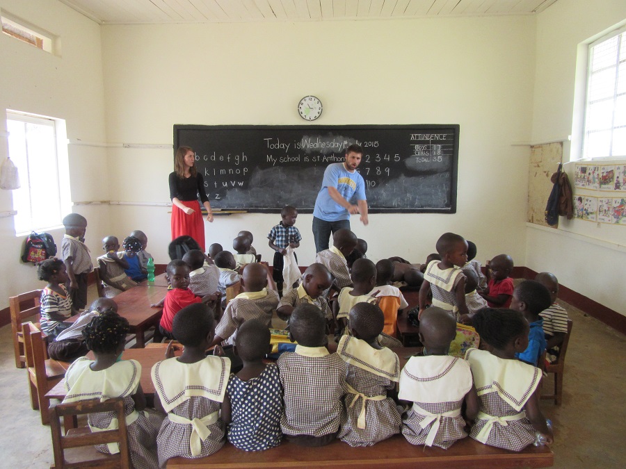 Kollin and I teach the children at St. Anthony a song. Kollin and I teach the children at St. Anthony a song.