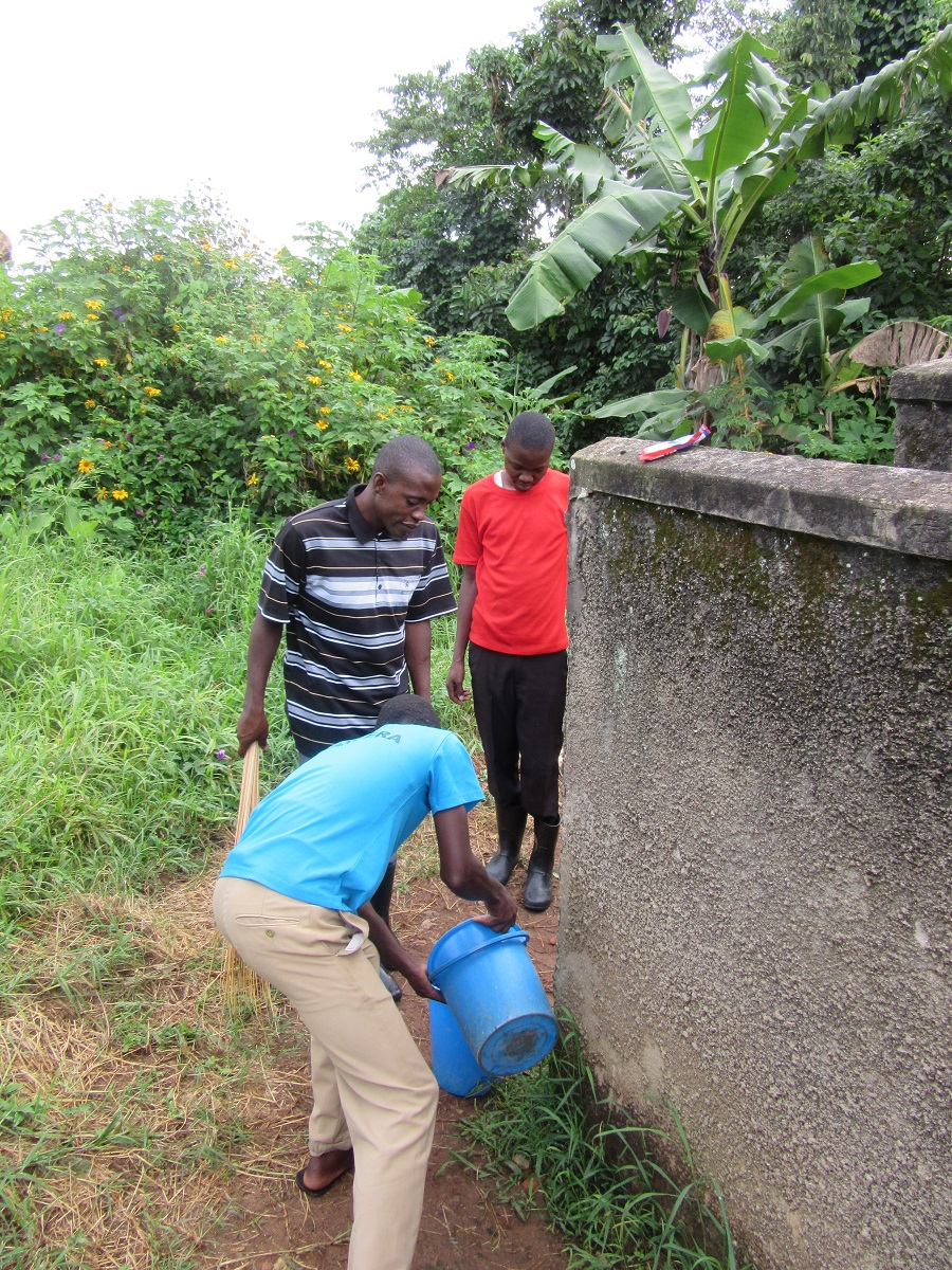 Frank had organized some of the teens in the CARITAS child sponsorship programs to volunteer to clean the Nkokonjeru parish church and grounds recently. Here, Frank enlisted the help of two boys, Laurence, in blue, and Robert, in red, to clean the bathrooms. Frank had organized some of the teens in the CARITAS child sponsorship programs to volunteer to clean the Nkokonjeru parish church and grounds recently. Here, Frank enlisted the help of two boys, Laurence, in blue, and Robert, in red, to clean the bathrooms.